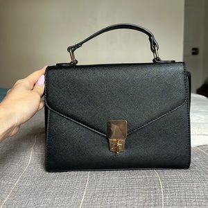 Brand new black top handle bag with crossbody strap